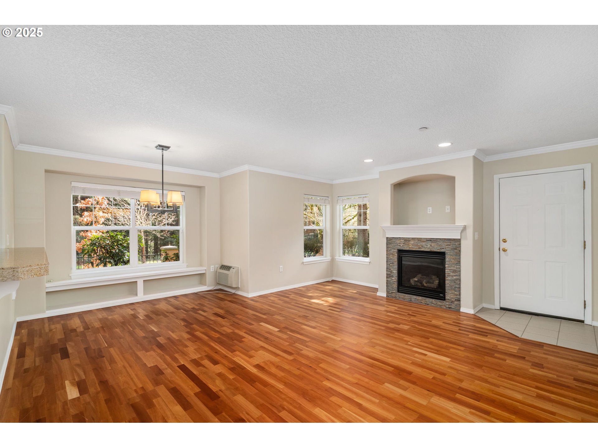 30406 Southwest Ruth Street, Unit 78 Wilsonville, OR 97070 - Photo 5 of 45 a view of an empty room with window and fireplace
