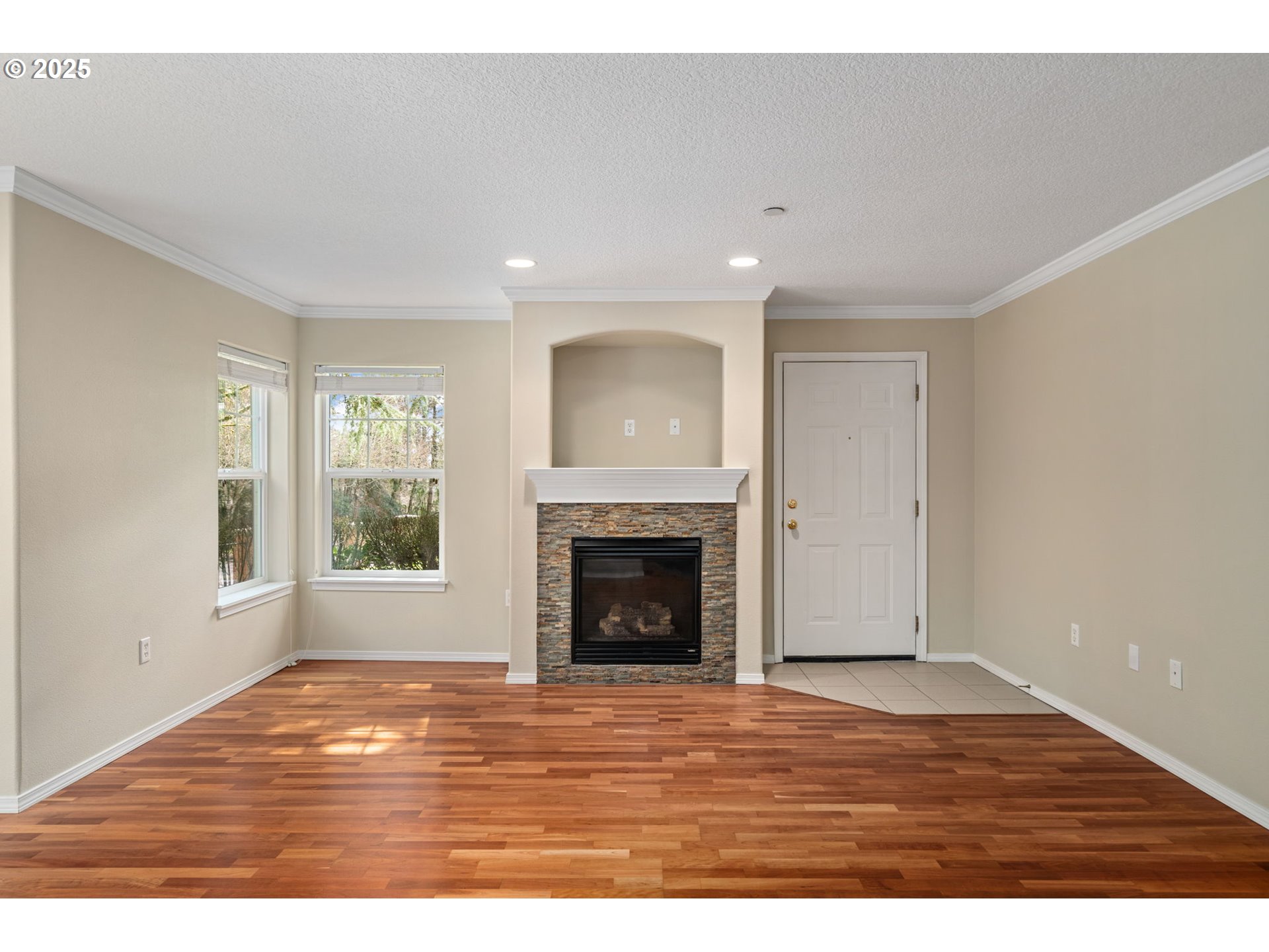 30406 Southwest Ruth Street, Unit 78 Wilsonville, OR 97070 - Photo 8 of 45 a view of an empty room with window and a fireplace