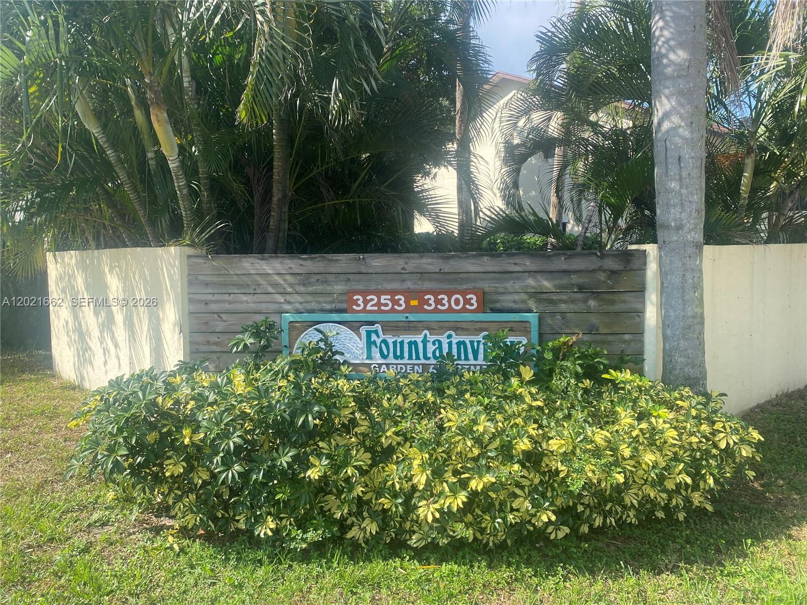 3263 Kirk Road, Unit 2 Lake Worth, FL 33461 - Photo 14 of 14 a view of sign board with large trees