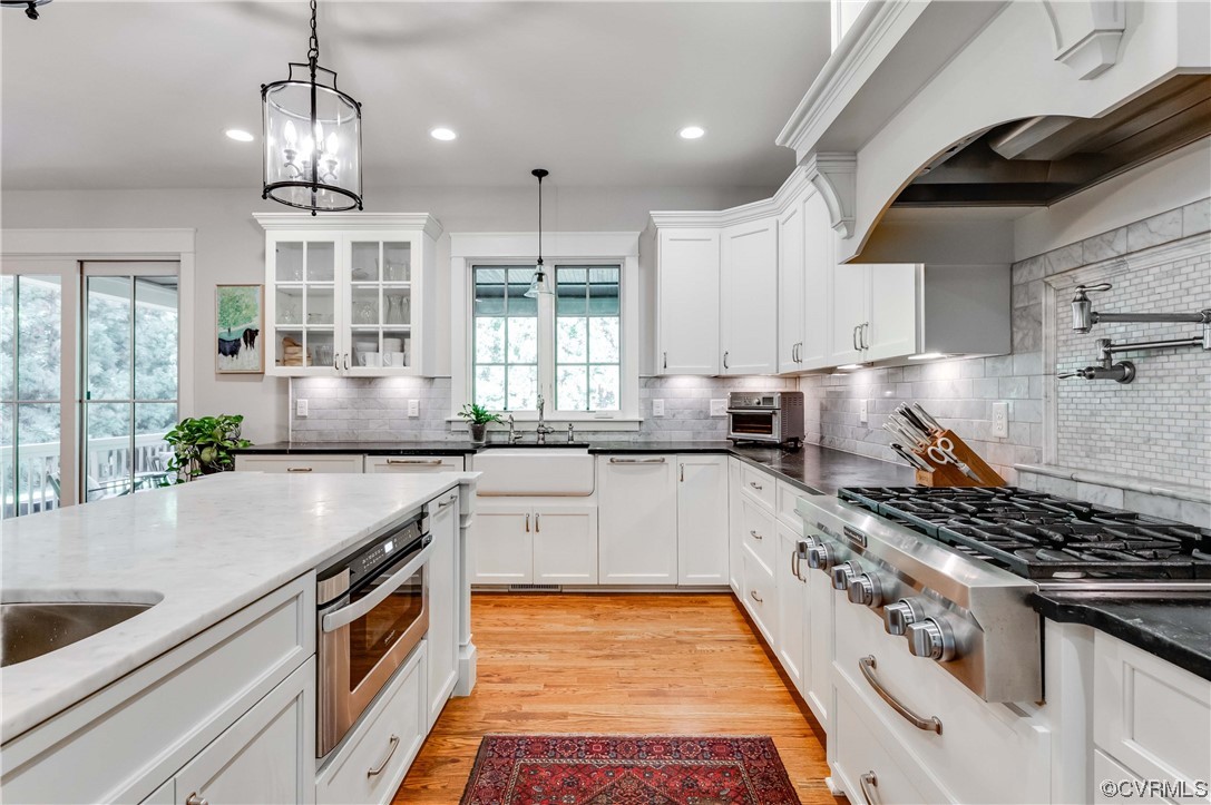 206 Running Cedar Lane Henrico, VA 23229 - Photo 11 of 33 a kitchen with granite countertop a sink and a stove top oven