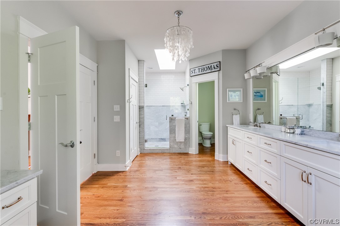 206 Running Cedar Lane Henrico, VA 23229 - Photo 26 of 33 a spacious bathroom with a granite countertop sink a mirror and a shower