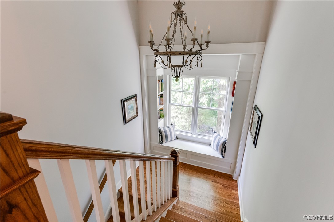 206 Running Cedar Lane Henrico, VA 23229 - Photo 28 of 33 a view of a hallway with wooden floor and chandelier