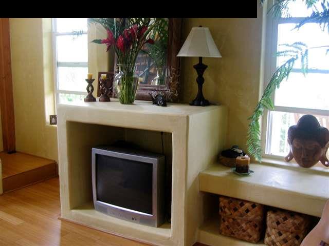 438 Kaupakalua Road Haiku, HI 96708 - Photo 7 of 18 a kitchen with a fireplace and a window