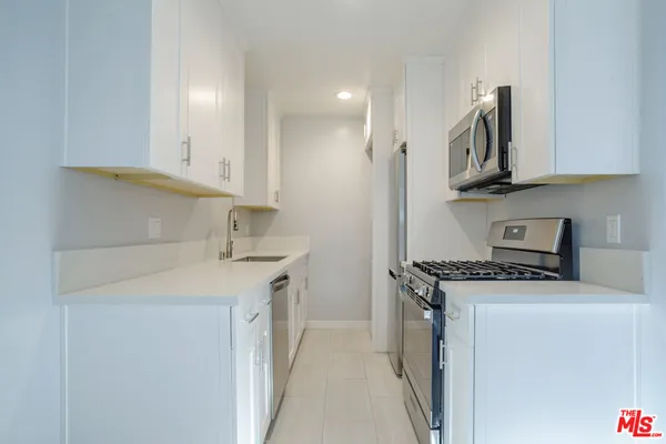 a kitchen with a stove and a microwave