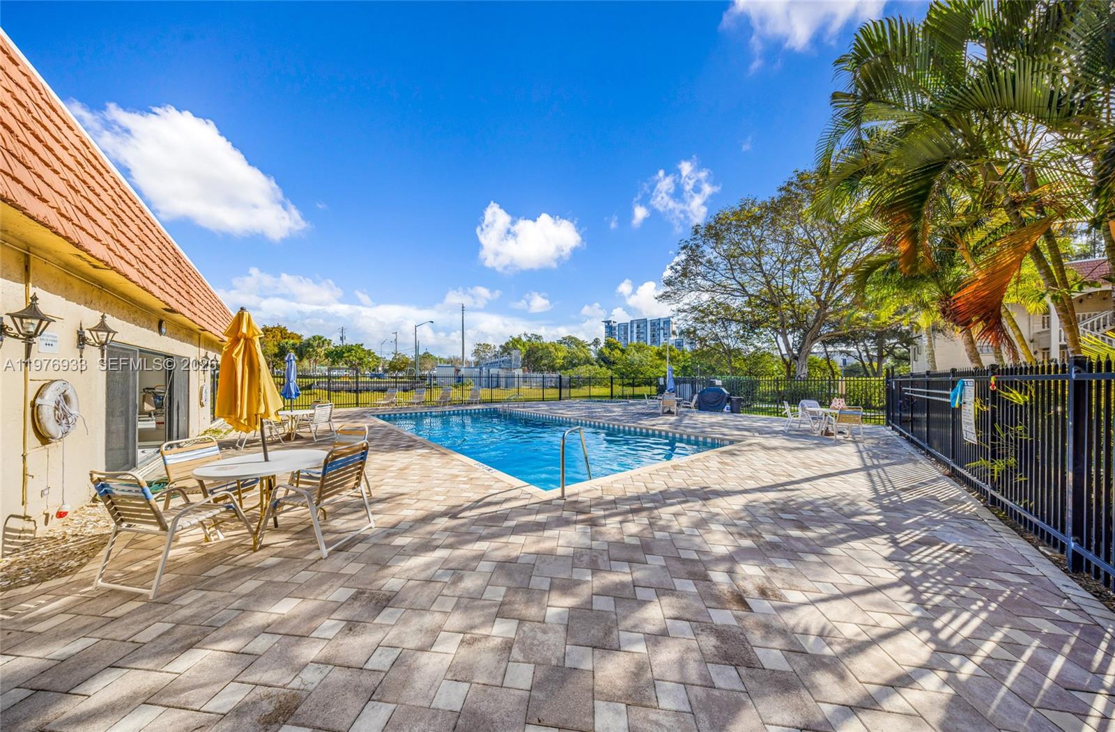 130 South Cypress Road, Unit 612 Pompano Beach, FL 33060 - Photo 12 of 33 a view of a patio with swimming pool