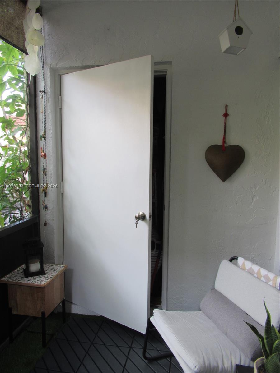 130 South Cypress Road, Unit 612 Pompano Beach, FL 33060 - Photo 28 of 33 a room with a table and a chair