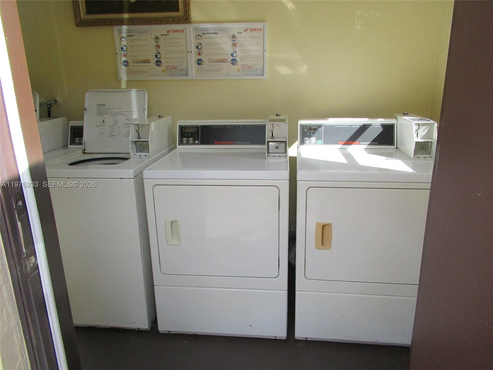 130 South Cypress Road, Unit 612 Pompano Beach, FL 33060 - Photo 30 of 33 a utility room with dryer and washer