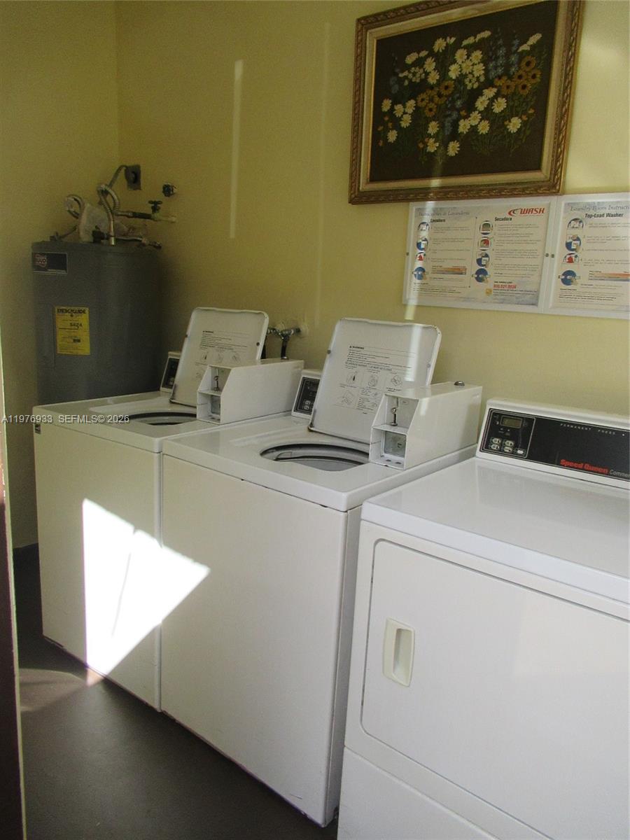 130 South Cypress Road, Unit 612 Pompano Beach, FL 33060 - Photo 31 of 33 a utility room with dryer and washer