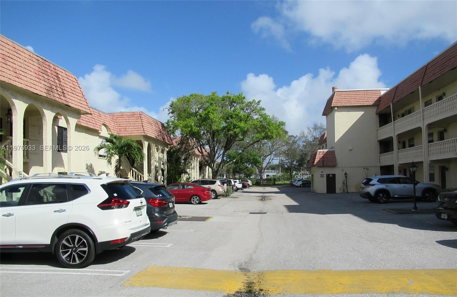 130 South Cypress Road, Unit 612 Pompano Beach, FL 33060 - Photo 33 of 33 a car parked in front of a building