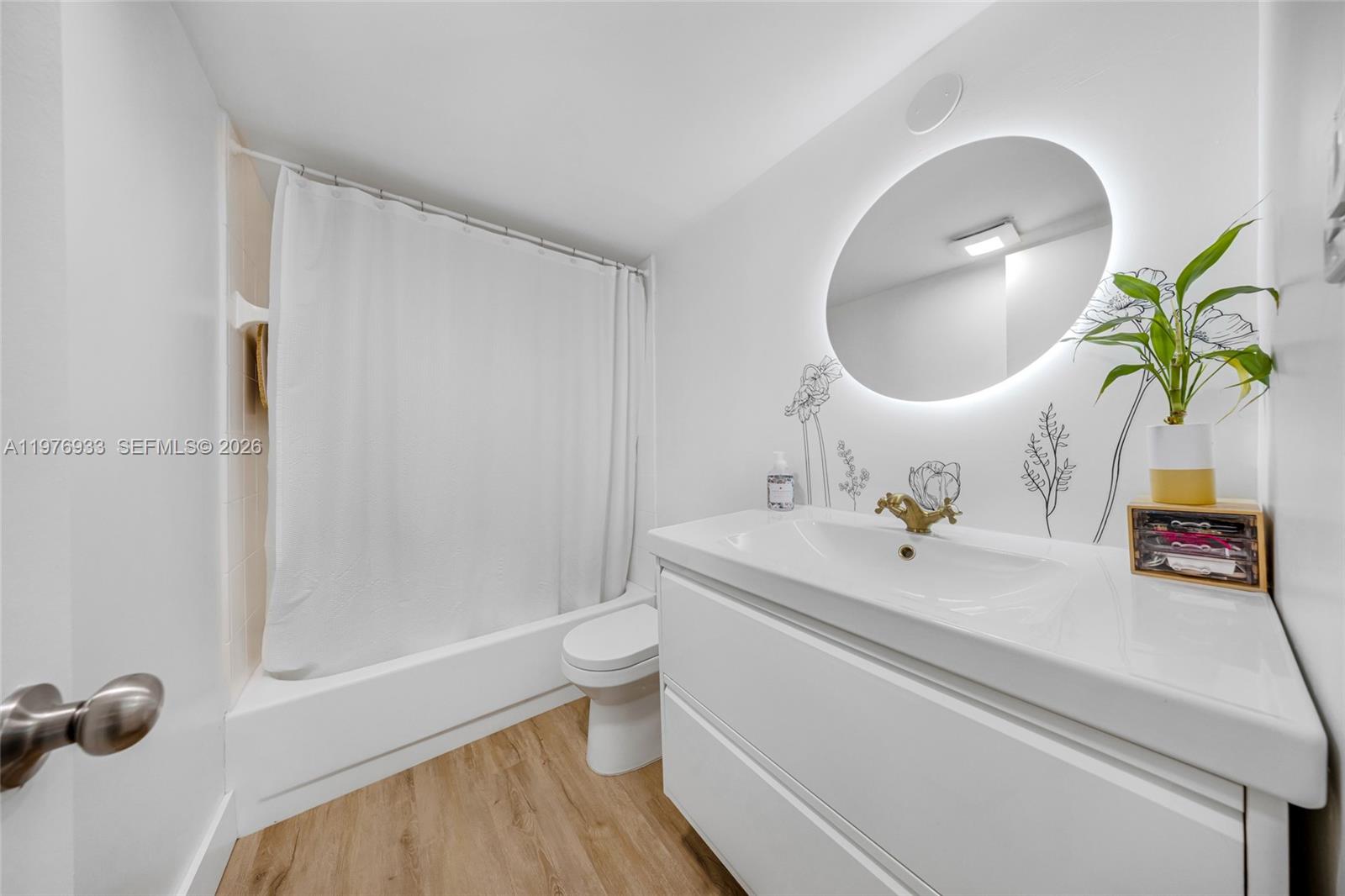 130 South Cypress Road, Unit 612 Pompano Beach, FL 33060 - Photo 6 of 33 a bathroom with a sink toilet and shower