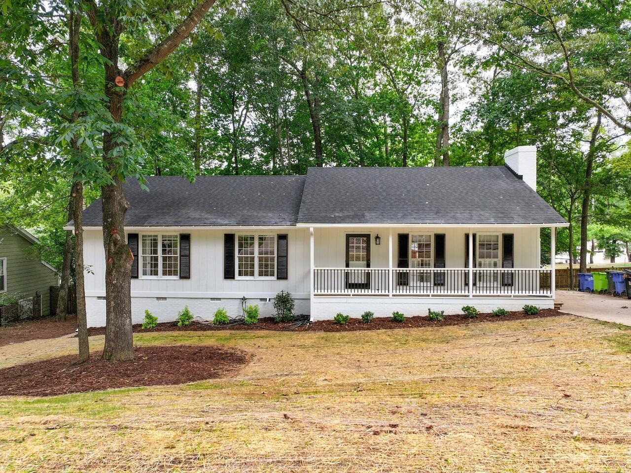 4504 Wenchelsea Place Raleigh, NC 27612 - Photo 1 of 27 a front view of a house with swimming pool
