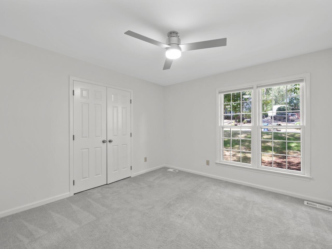 4504 Wenchelsea Place Raleigh, NC 27612 - Photo 13 of 27 a view of an empty room with a window
