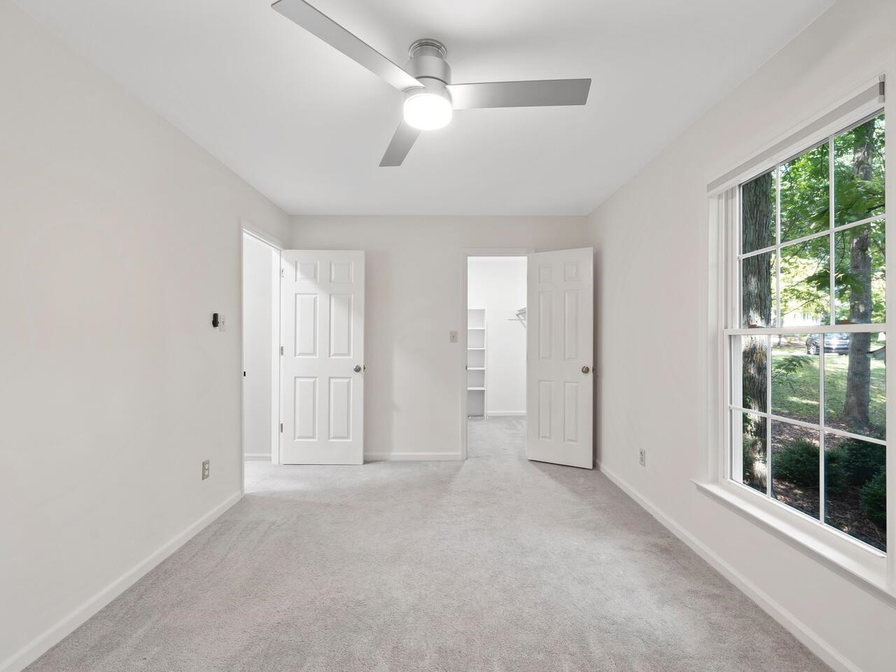 4504 Wenchelsea Place Raleigh, NC 27612 - Photo 16 of 27 an empty room with windows and entrance