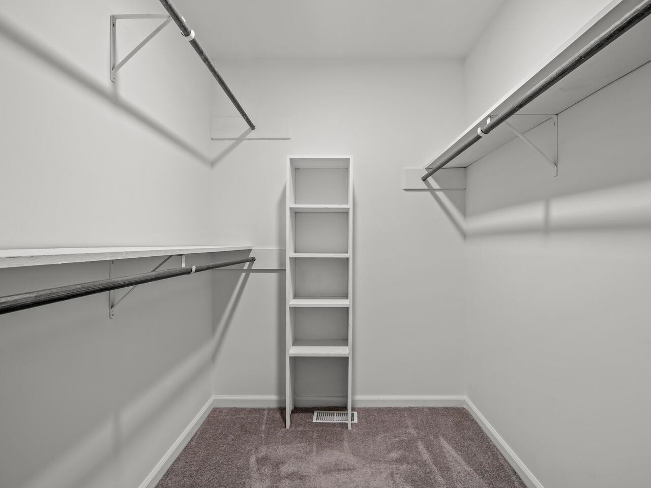 4504 Wenchelsea Place Raleigh, NC 27612 - Photo 17 of 27 a view of an empty walk in closet