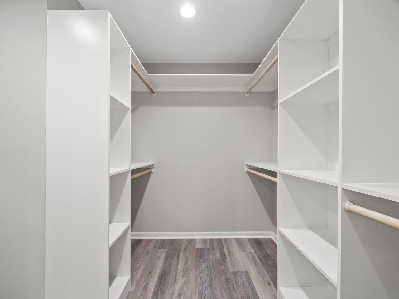 4504 Wenchelsea Place Raleigh, NC 27612 - Photo 20 of 27 a view of walk in closet with empty racks