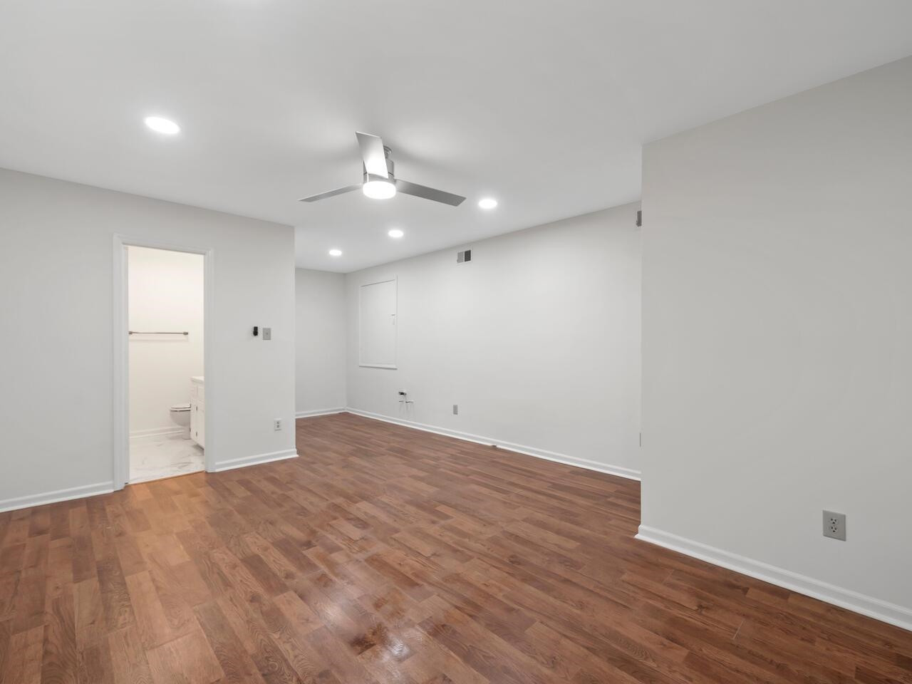 4504 Wenchelsea Place Raleigh, NC 27612 - Photo 22 of 27 a view of an empty room with wooden floor