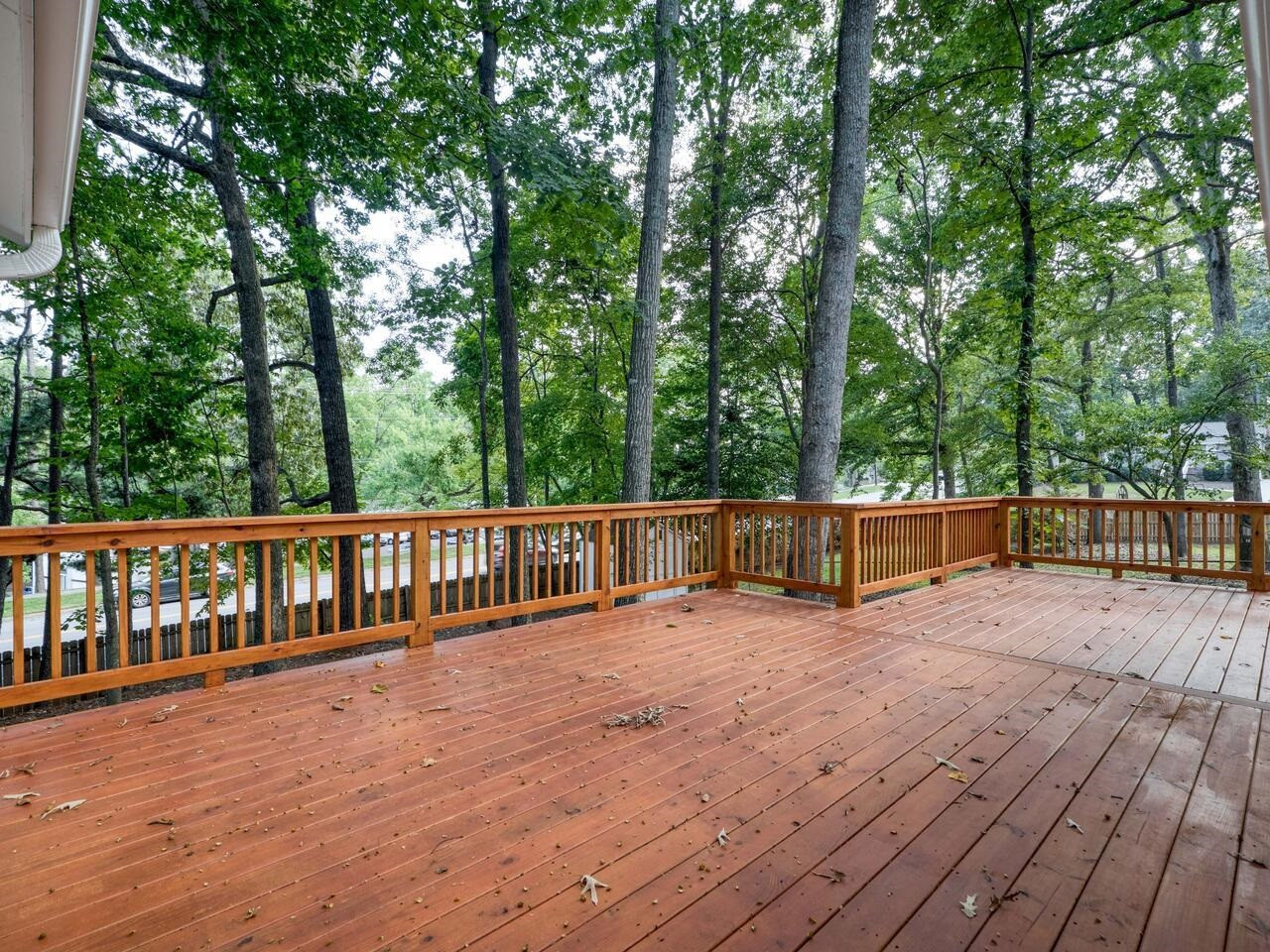 4504 Wenchelsea Place Raleigh, NC 27612 - Photo 25 of 27 a view of balcony with wooden floor and fence