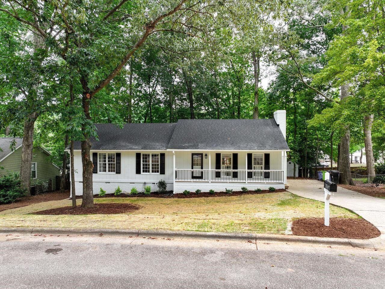 4504 Wenchelsea Place Raleigh, NC 27612 - Photo 26 of 27 front view of a house with a patio
