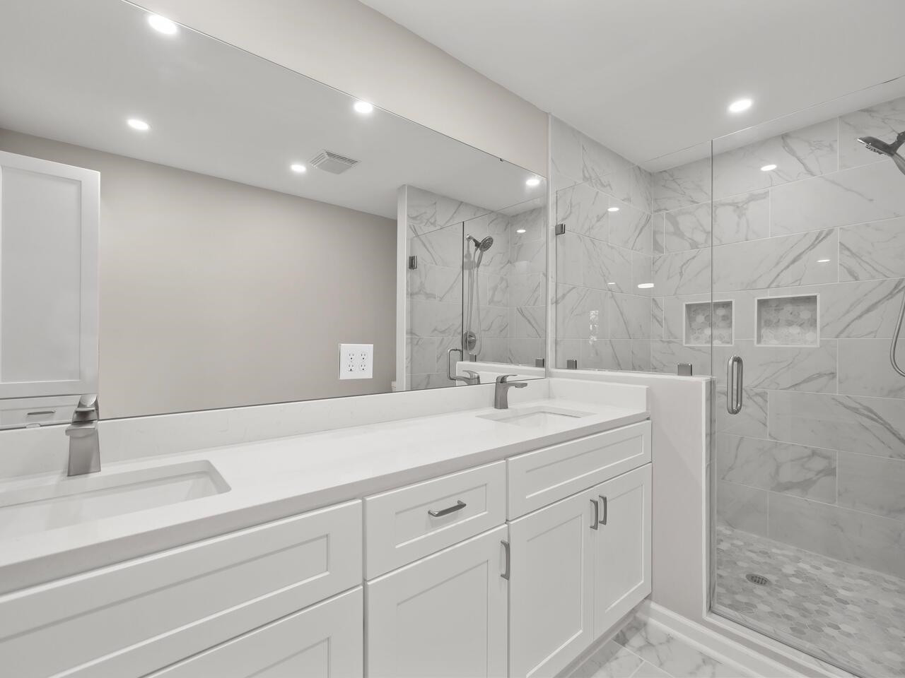4504 Wenchelsea Place Raleigh, NC 27612 - Photo 3 of 27 a bathroom with a sink double vanity and a mirror
