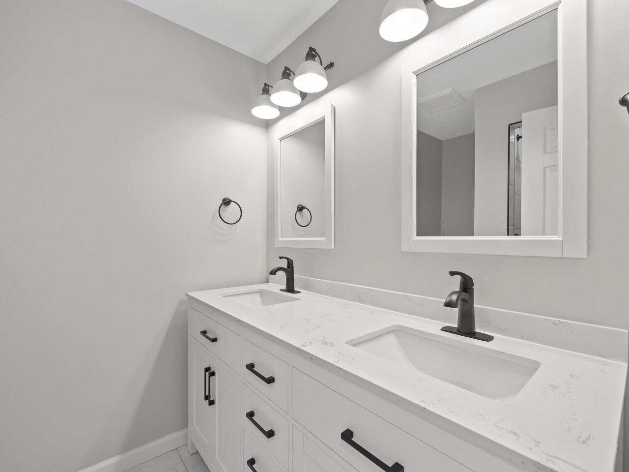 4504 Wenchelsea Place Raleigh, NC 27612 - Photo 4 of 27 a bathroom with a sink and a mirror