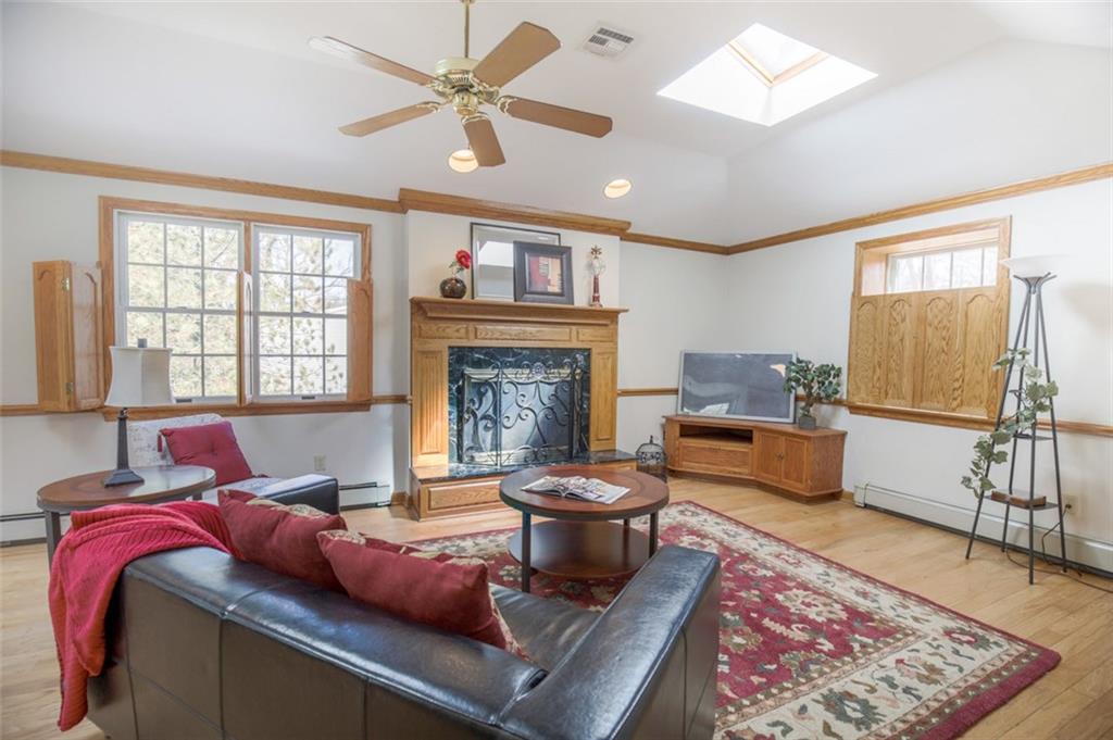 123 Lamar Road Pittsburgh, PA 15241 - Photo 10 of 25 Eloquently constructed addition with wood trim, fireplace, sky lights & functioning plantation shutters.