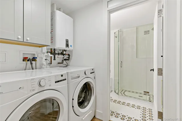a view of bathroom with washer and dryer
