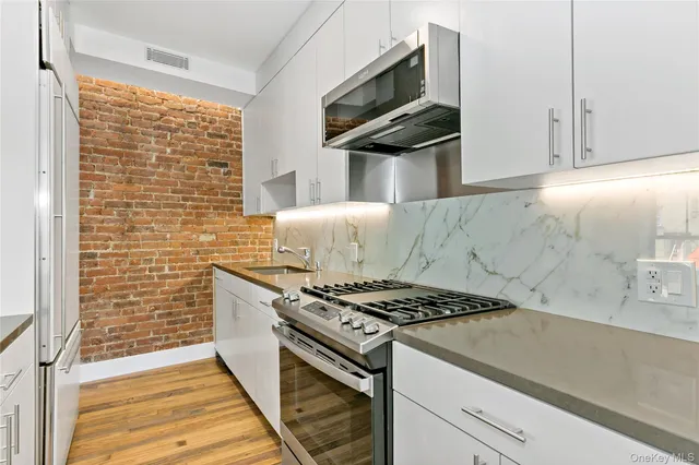 a kitchen with a stove and a microwave