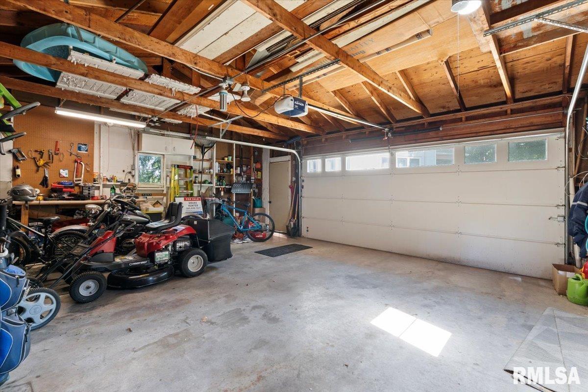 101 South Stewart Street Geneseo, IL 61254 - Photo 11 of 41 a view of a garage with parked cars