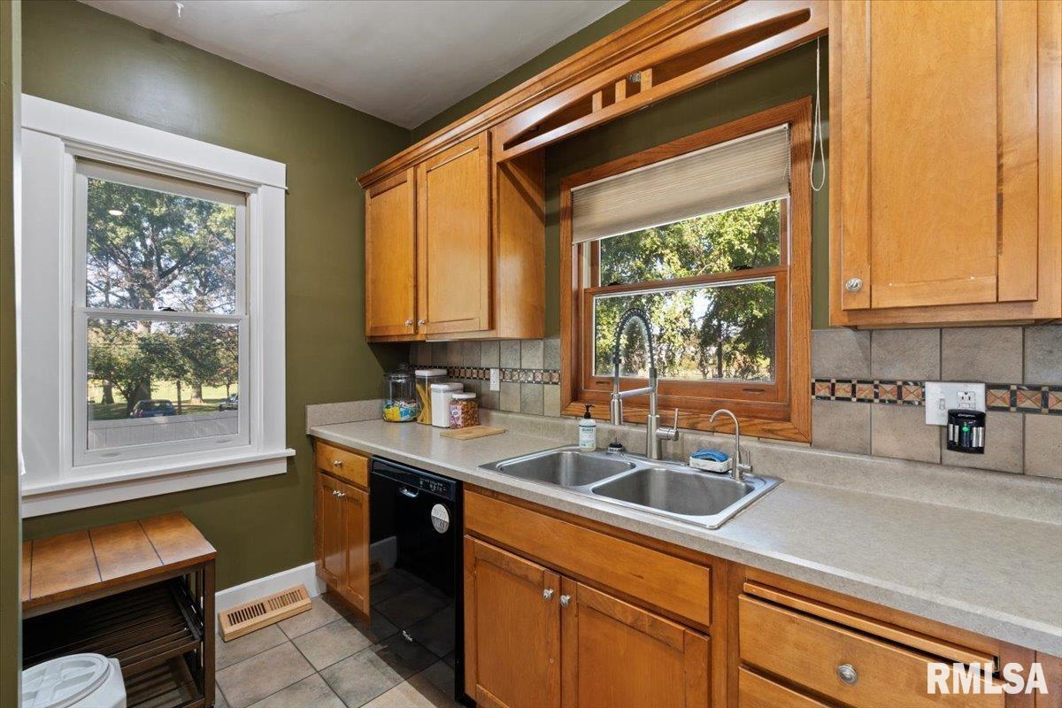 101 South Stewart Street Geneseo, IL 61254 - Photo 13 of 41 a kitchen with a sink and a window