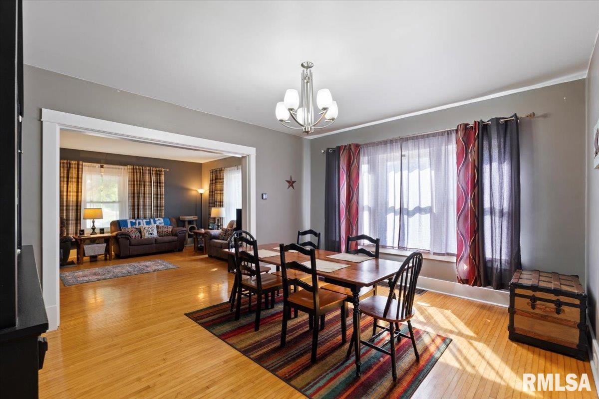 101 South Stewart Street Geneseo, IL 61254 - Photo 18 of 41 a view of a dining room with furniture window and wooden floor