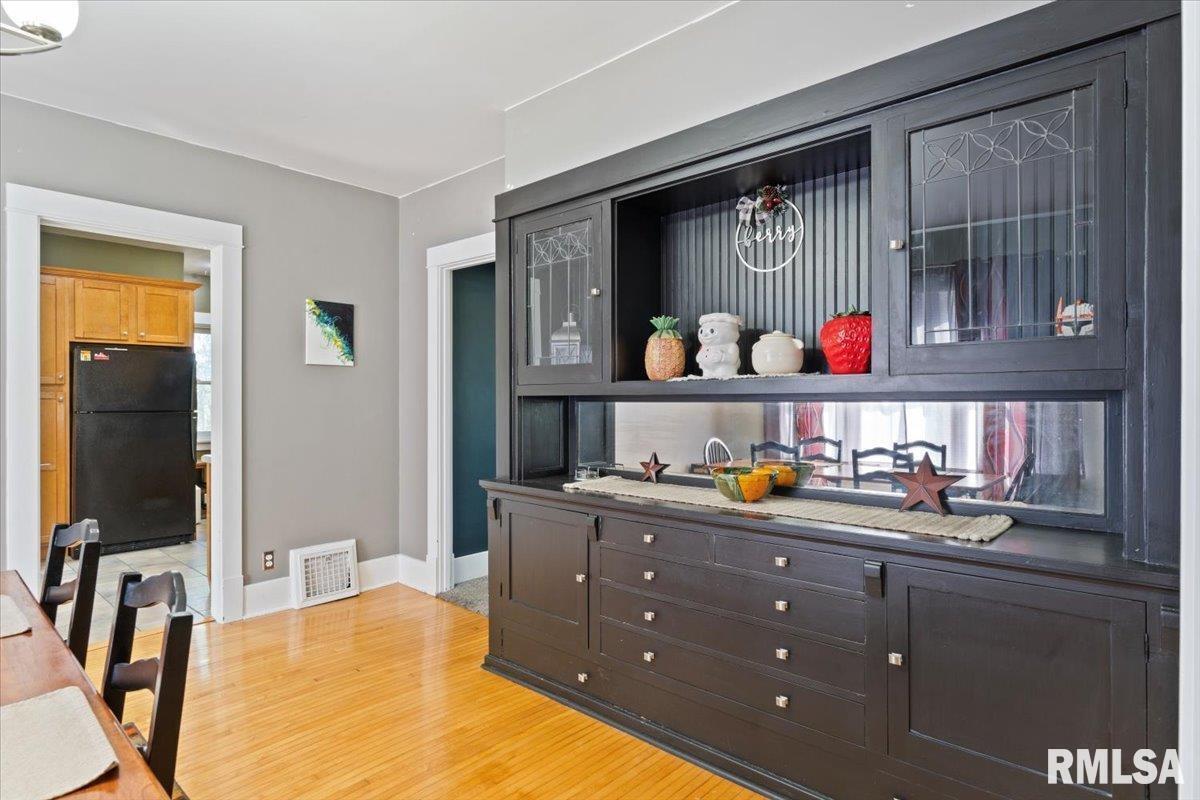 101 South Stewart Street Geneseo, IL 61254 - Photo 24 of 41 a kitchen with stainless steel appliances granite countertop a sink and cabinets