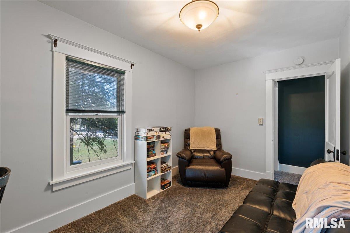101 South Stewart Street Geneseo, IL 61254 - Photo 32 of 41 a bedroom with furniture and a window