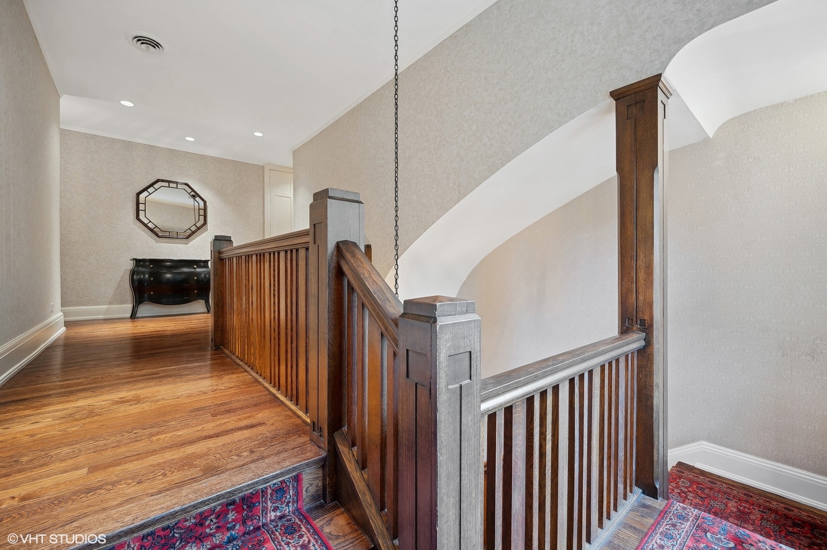 888 Tower Road Winnetka, IL 60093 - Photo 35 of 80 a view of a hallway view with wooden floor and staircase