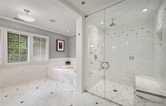 888 Tower Road Winnetka, IL 60093 - Photo 38 of 80 a bathroom with a granite countertop sink a large mirror and shower