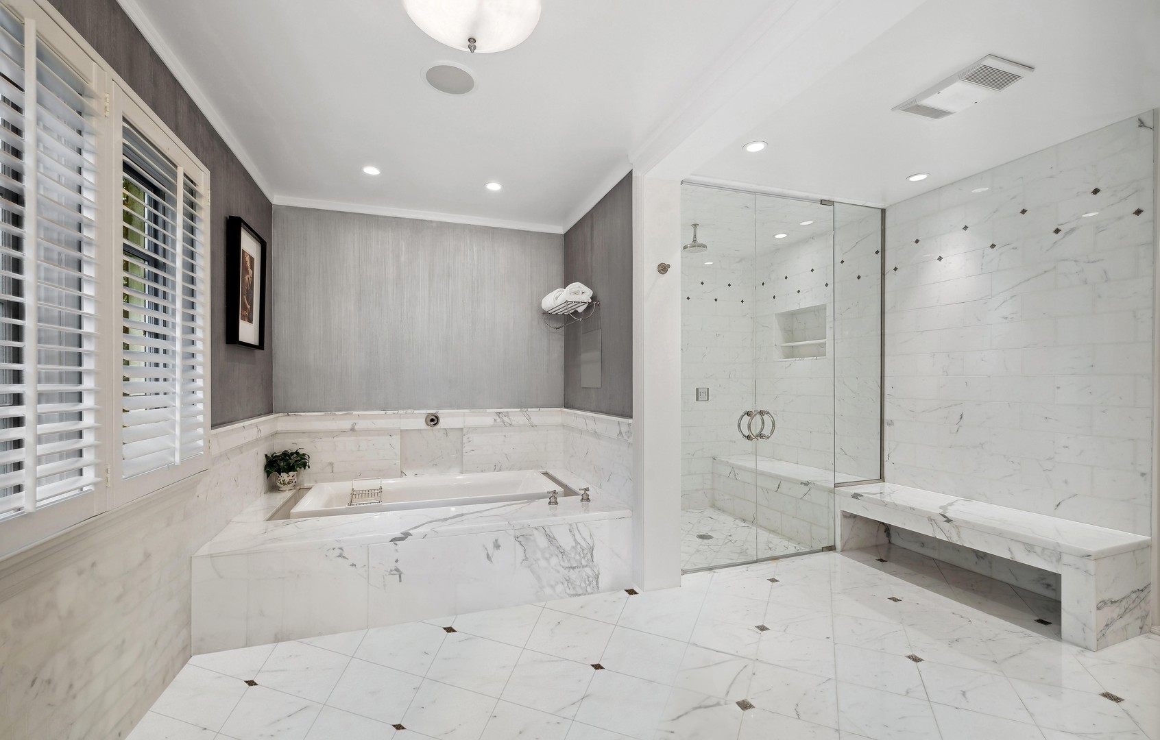 888 Tower Road Winnetka, IL 60093 - Photo 40 of 80 a bathroom with a tub sink and shower