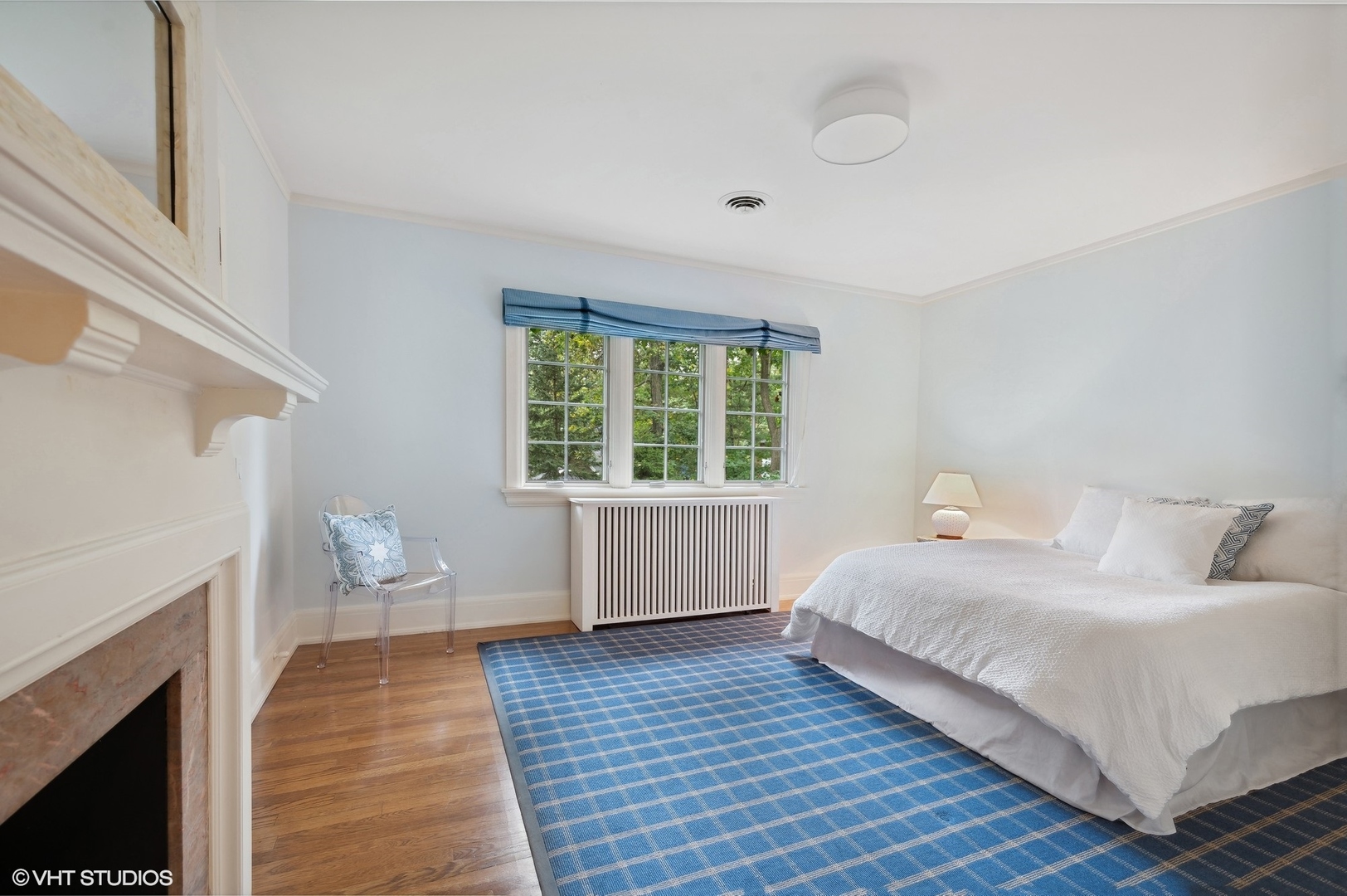 888 Tower Road Winnetka, IL 60093 - Photo 47 of 80 a bedroom with a bed and a fireplace