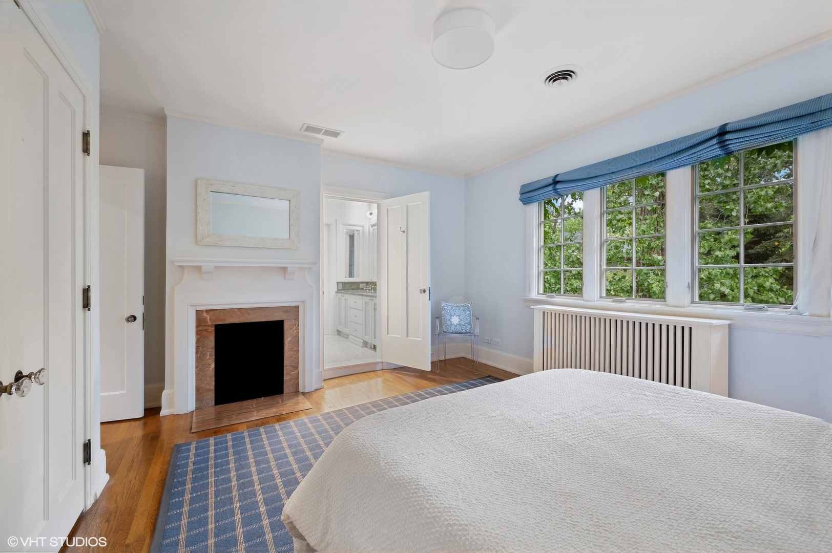 888 Tower Road Winnetka, IL 60093 - Photo 48 of 80 a bedroom with a large bed and a fireplace