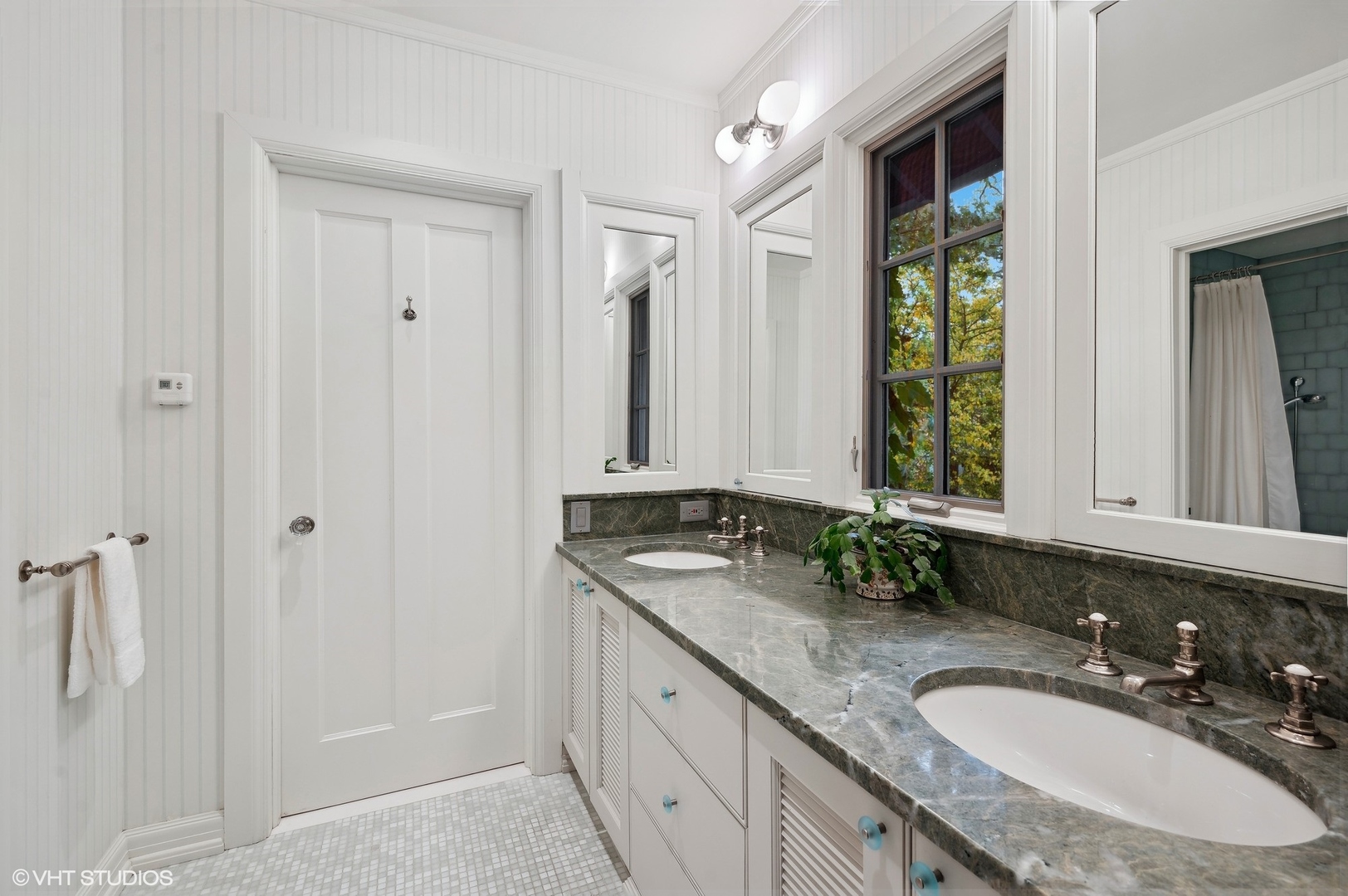 888 Tower Road Winnetka, IL 60093 - Photo 49 of 80 a bathroom with a granite countertop sink and a mirror