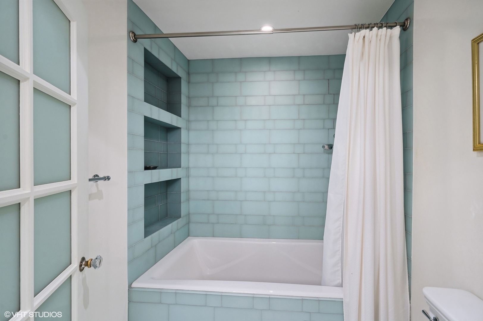 888 Tower Road Winnetka, IL 60093 - Photo 50 of 80 a bathroom with a shower and bathtub