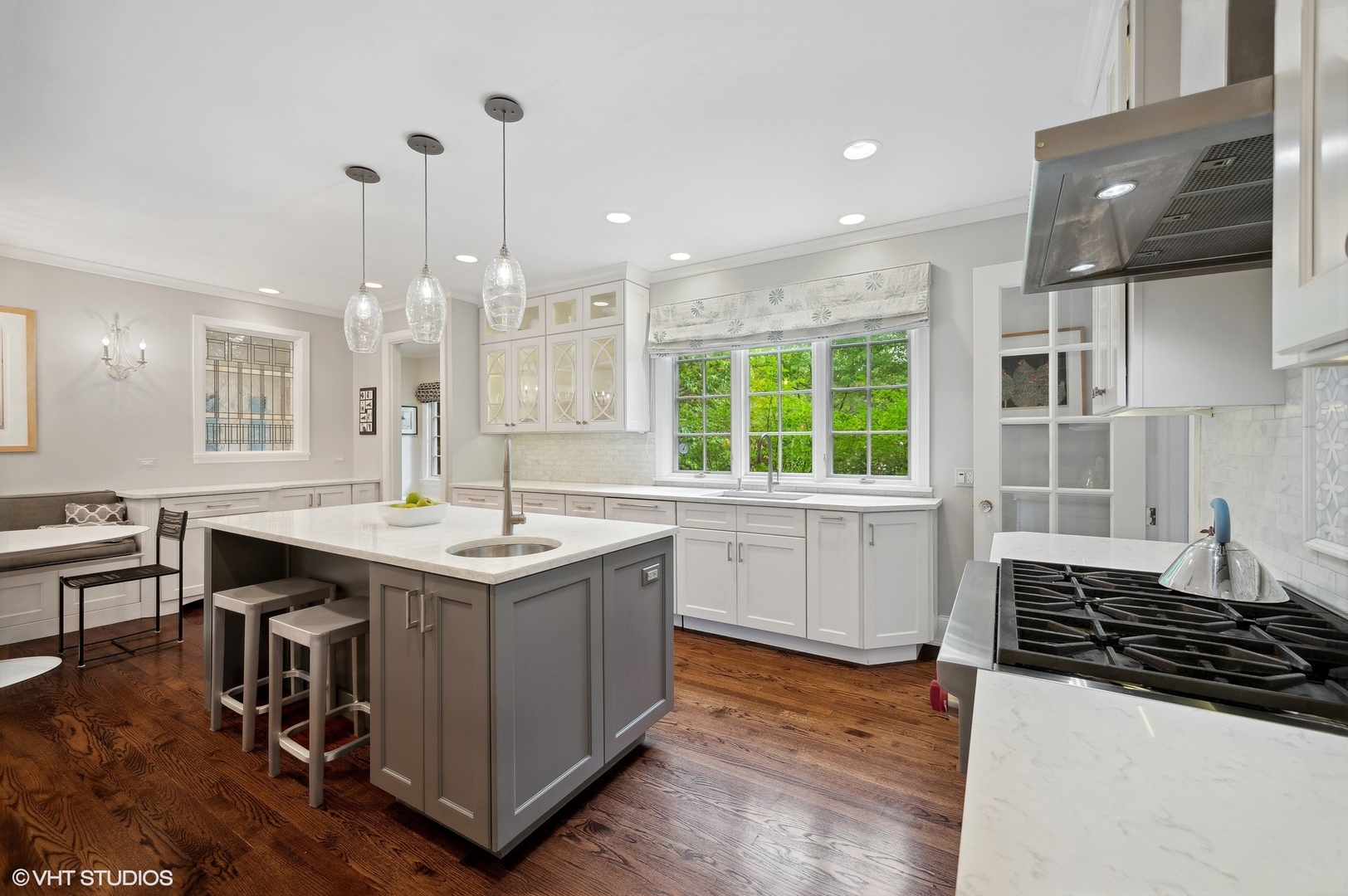 888 Tower Road Winnetka, IL 60093 - Photo 5 of 80 a kitchen with a sink stove and wooden floor