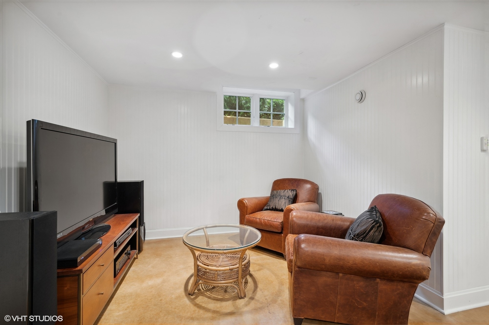 888 Tower Road Winnetka, IL 60093 - Photo 63 of 80 a living room with furniture a flat screen tv and a window