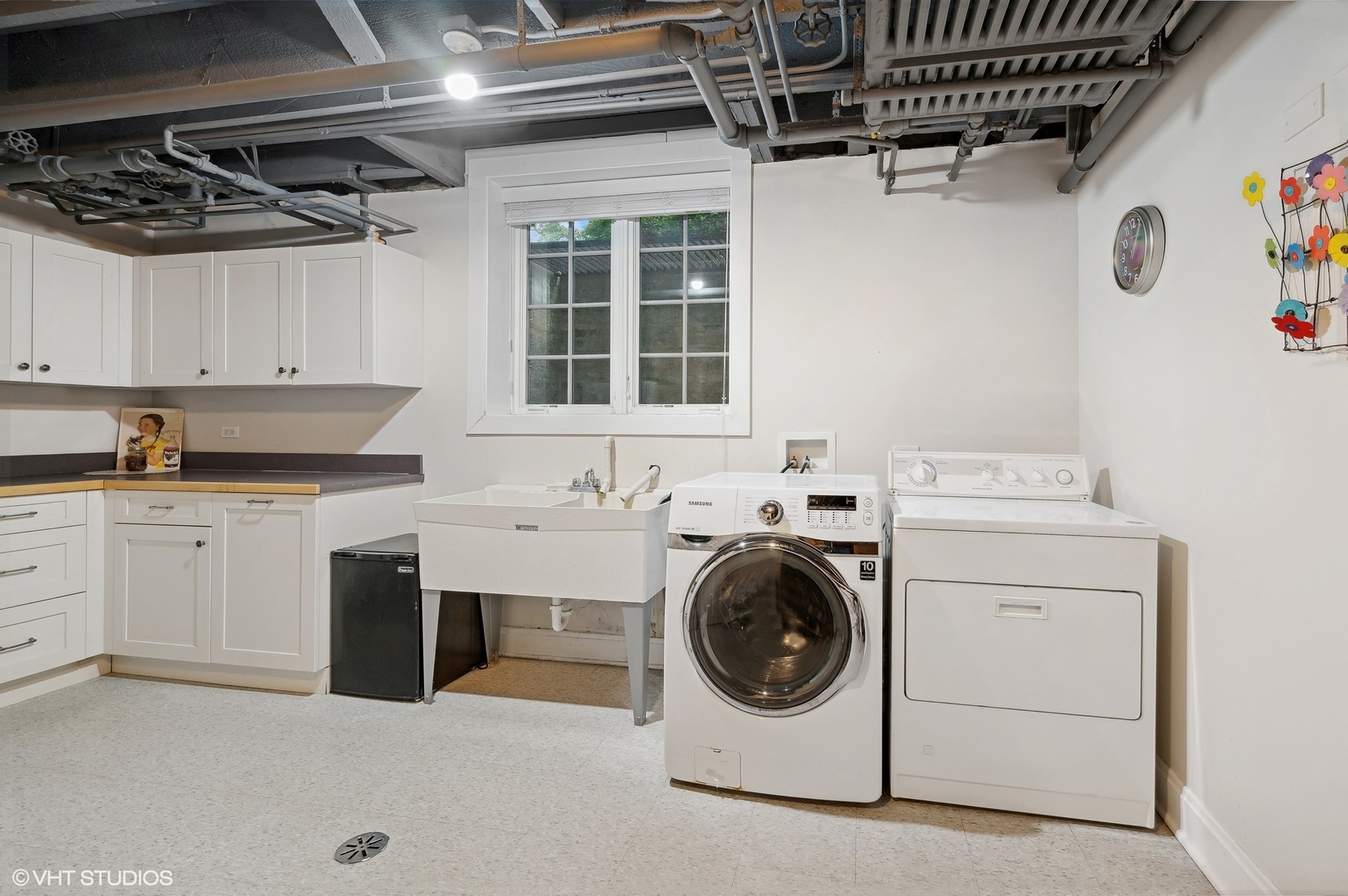 888 Tower Road Winnetka, IL 60093 - Photo 66 of 80 a utility room with cabinets washer and dryer
