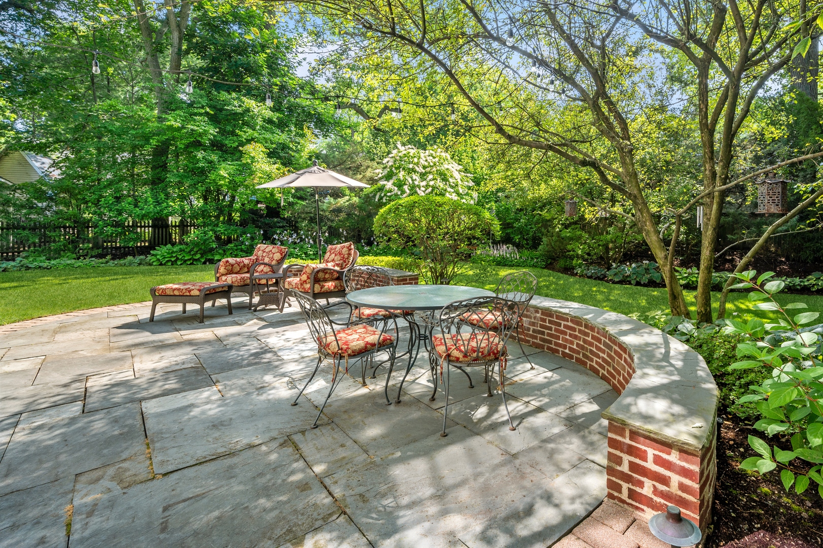 888 Tower Road Winnetka, IL 60093 - Photo 74 of 80 a view of a backyard with sitting area