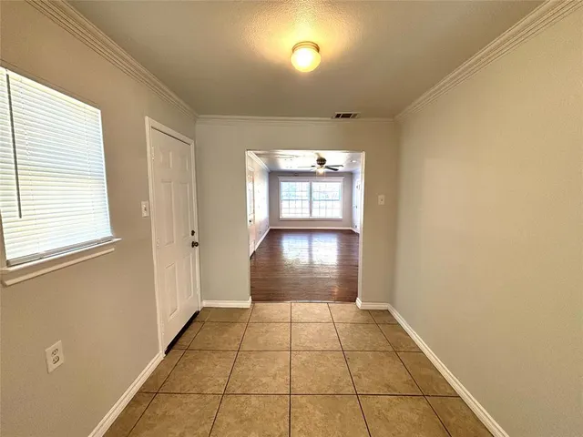 a view of an empty room and window