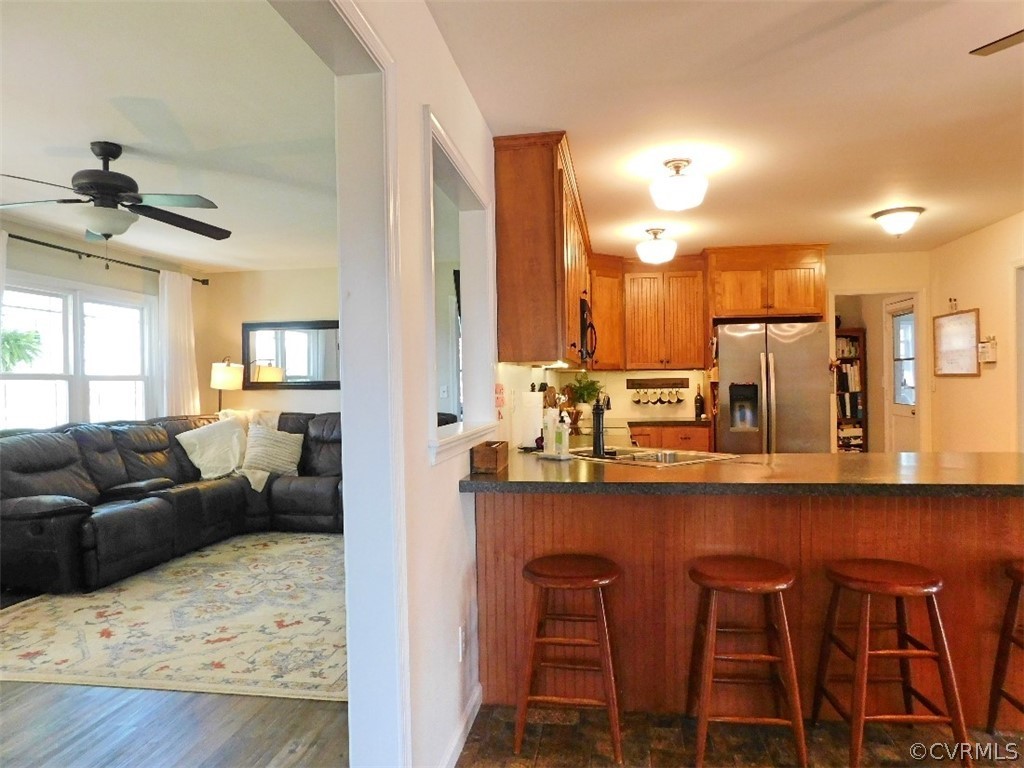1926 Little Cub Road Pamplin, VA 23958 - Photo 6 of 32 a living room with couches and kitchen view with wooden floor