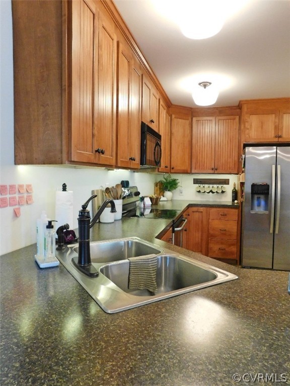 1926 Little Cub Road Pamplin, VA 23958 - Photo 7 of 32 a kitchen with stainless steel appliances granite countertop a sink a stove and a refrigerator with cabinets