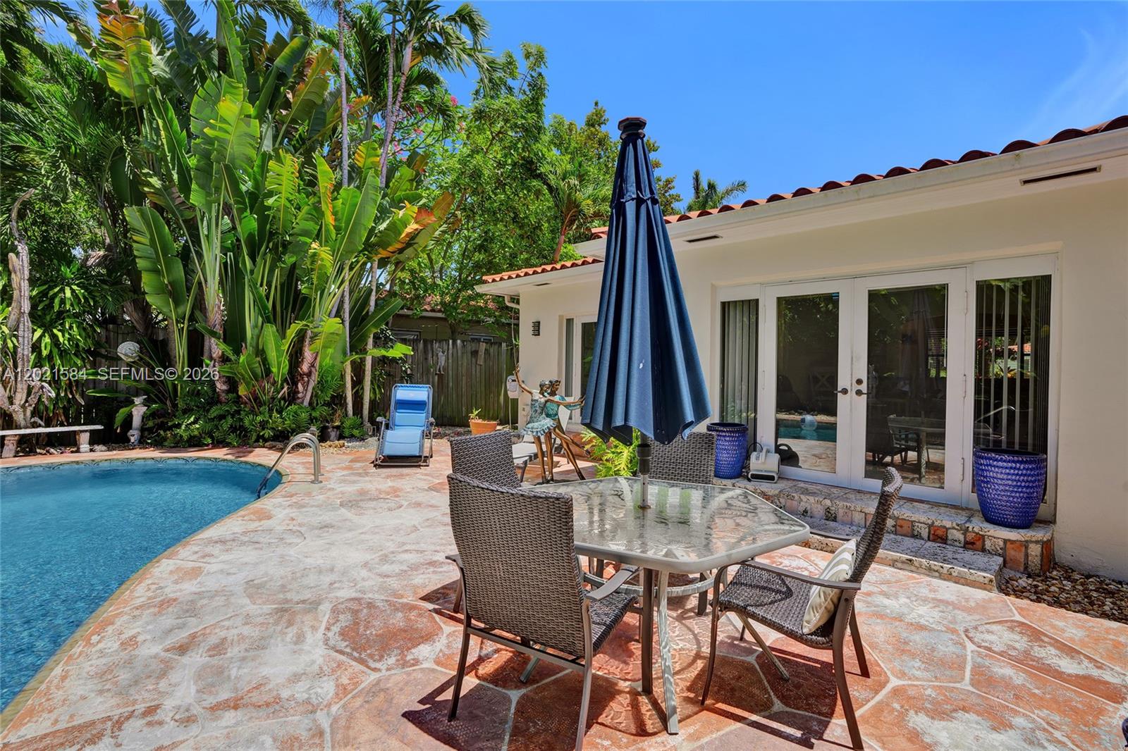 811 Northeast 73rd Street Miami, FL 33138 - Photo 29 of 51 a view of a patio with table and chairs and potted plants