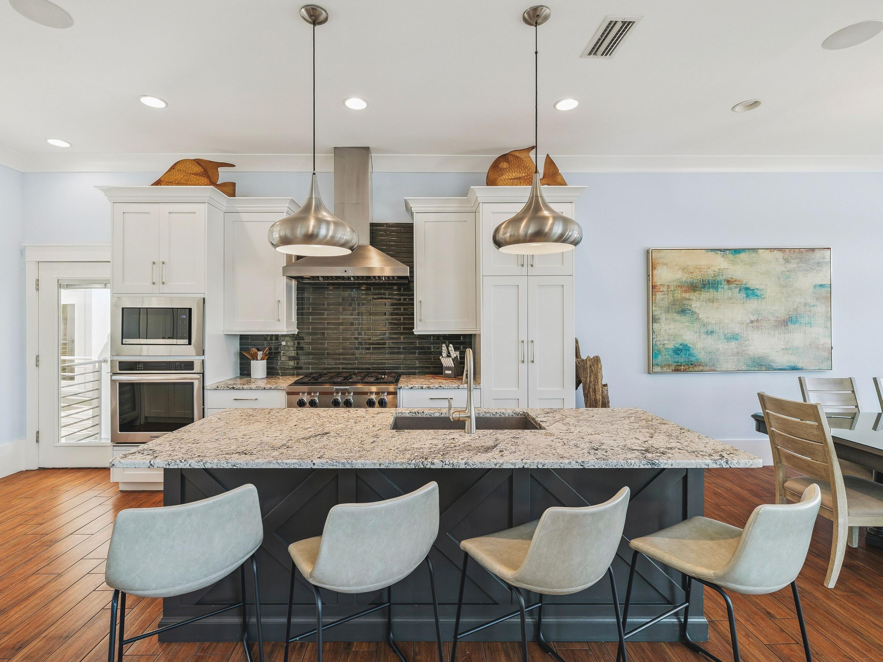 4659 Destiny Way Destin, FL 32541 - Photo 11 of 26 a kitchen with a dining table chairs and living room view