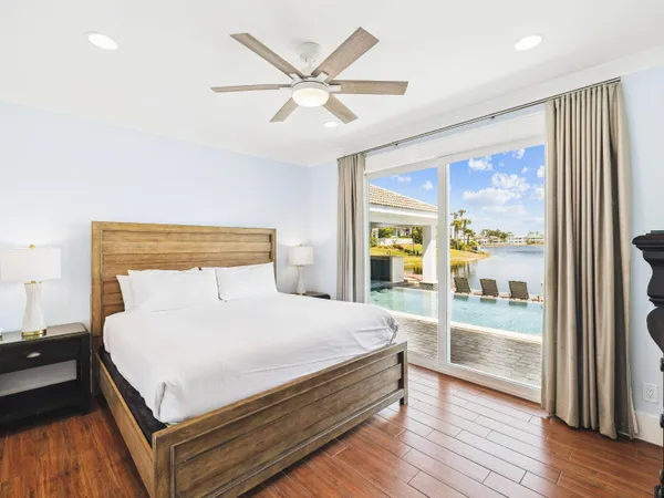a bedroom with a large bed and a large window