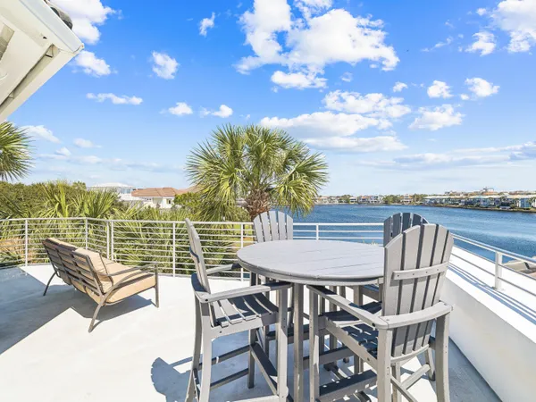 a view of a balcony with furniture
